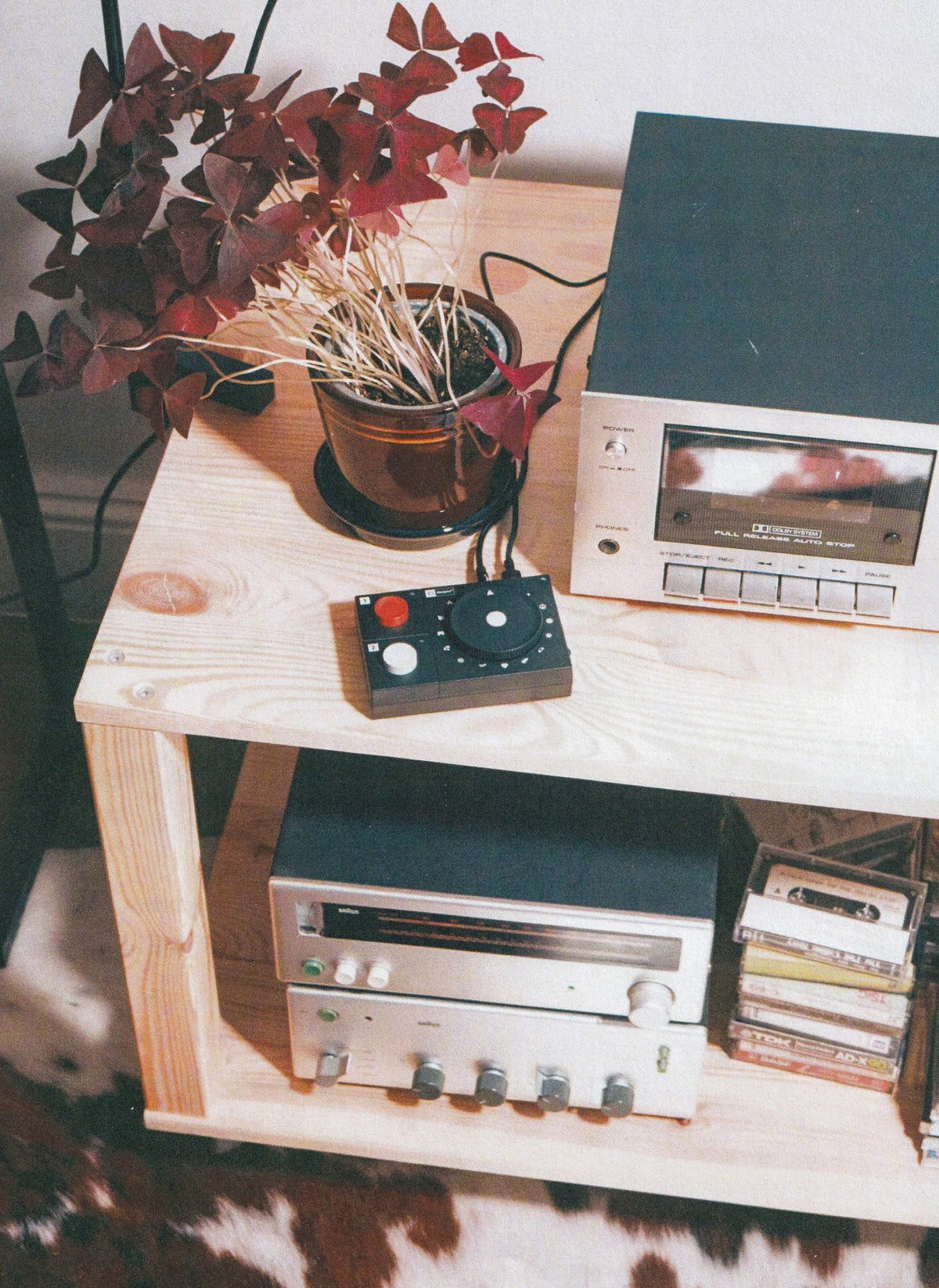 NTS Radio Player on a wooden shelf with a tape deck